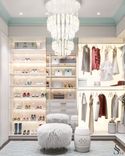 The unusual Sagarti chandelier and Fresq wallpaper are a special highlight of this dressing room