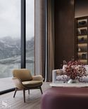Poltrona Frau leather armchair in the relaxation zone overlooking the mountain lake