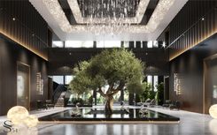 Expressive hall with a large orange tree. Jeff Koons sculptures adorn the space. A custom-made chandelier with thousands of crystals hangs from above. The wall finish is crafted from natural walnut with gradient staining