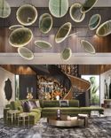 Unusual hanging installation made of transparent green disks