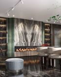 The bio fireplace is decorated with a variety of Cippolino striped marble and green velour.