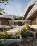 Transparent entrance hall that unites main and guest wings